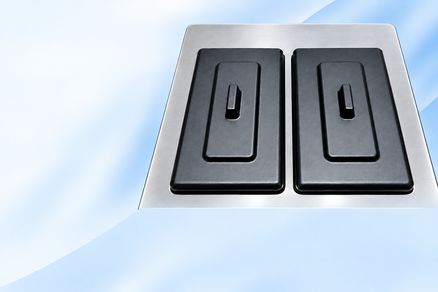 Two black mix hopper lids on the stainless-steel top of the photographed machine.